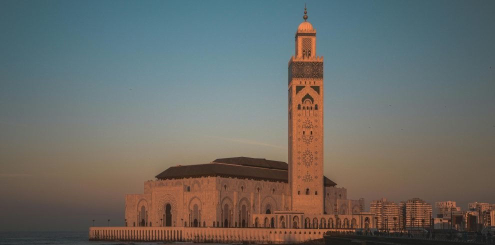 Stunning view of Hassan II Mosque against the sunset sky in Casablanca, Morocco.