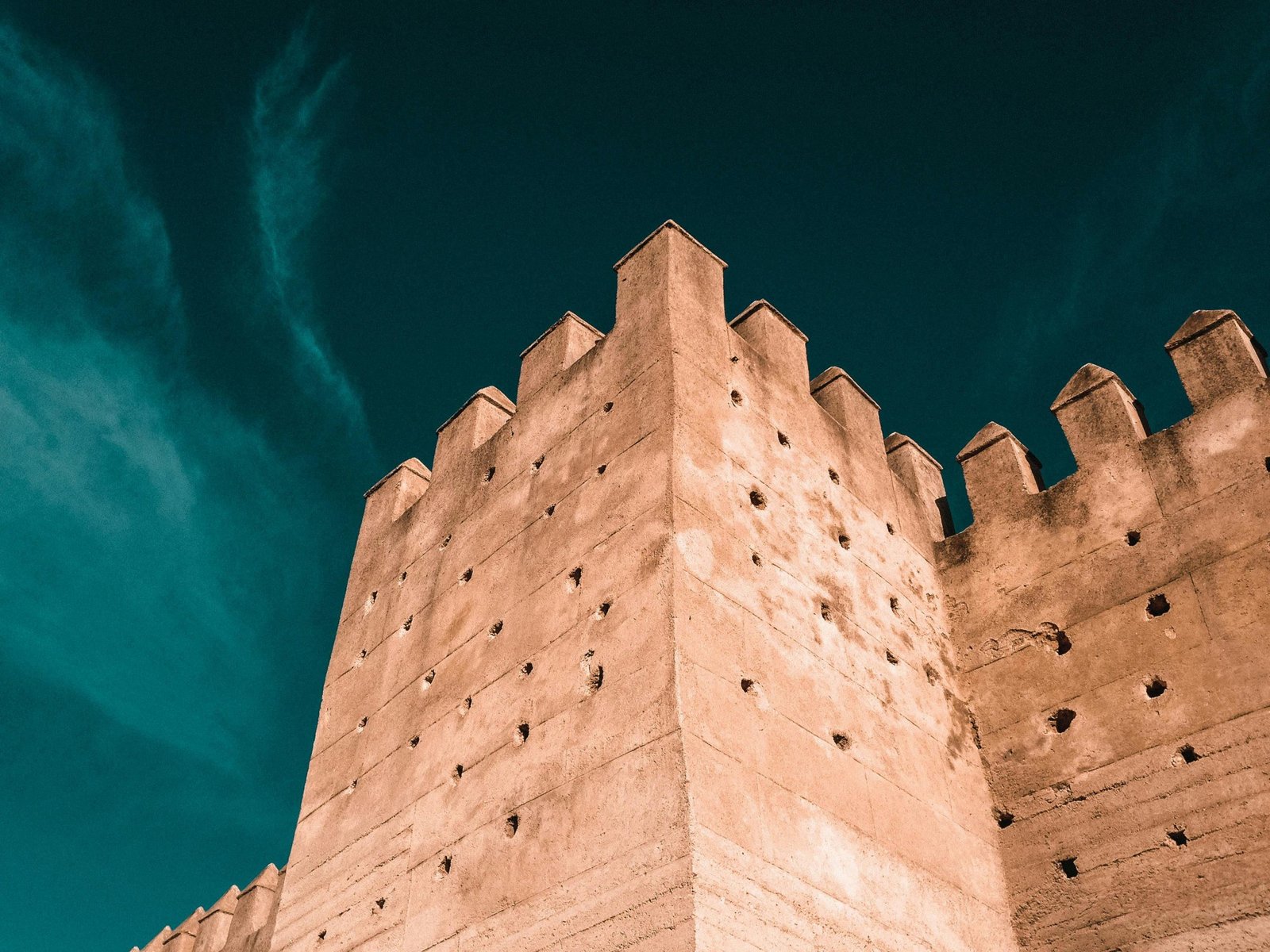 A stunning capture of the historic fortification wall in Fes, Morocco, showcasing traditional architecture.